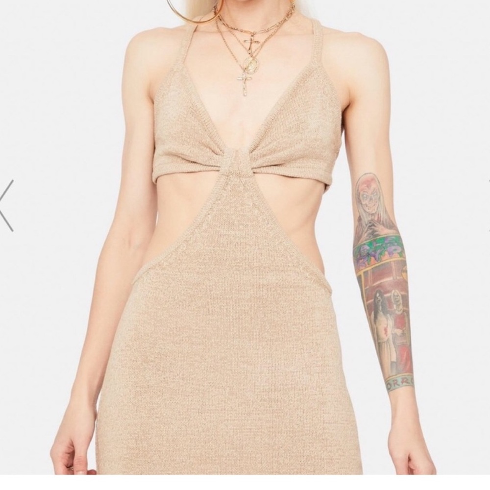 Beige Botany knit cut out dress.